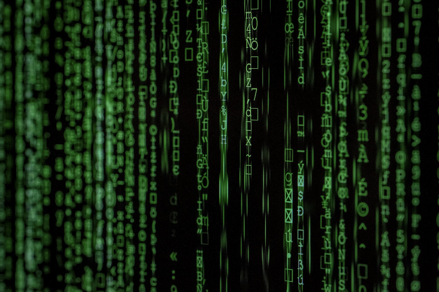 Streams of code on a dark screen