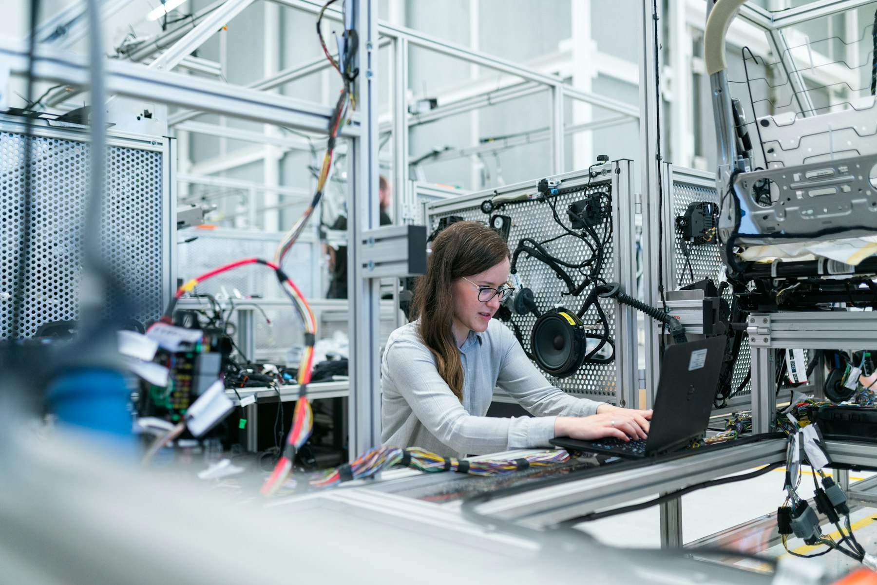 Engineer configuring equipment at a workstation